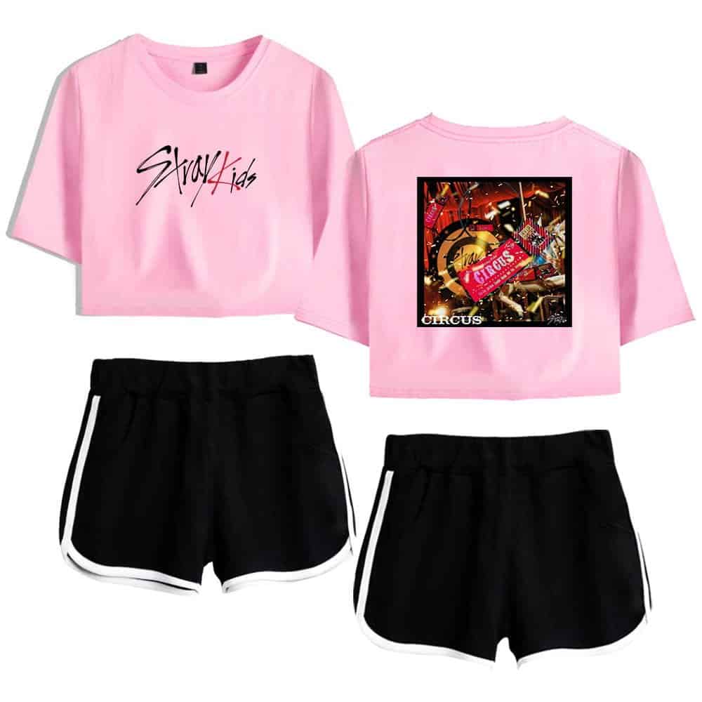 Striped black and white shorts with pink crop top featuring "Stray Kids" logo and circus-themed graphic on the back, trendy K-pop merchandise for fans.