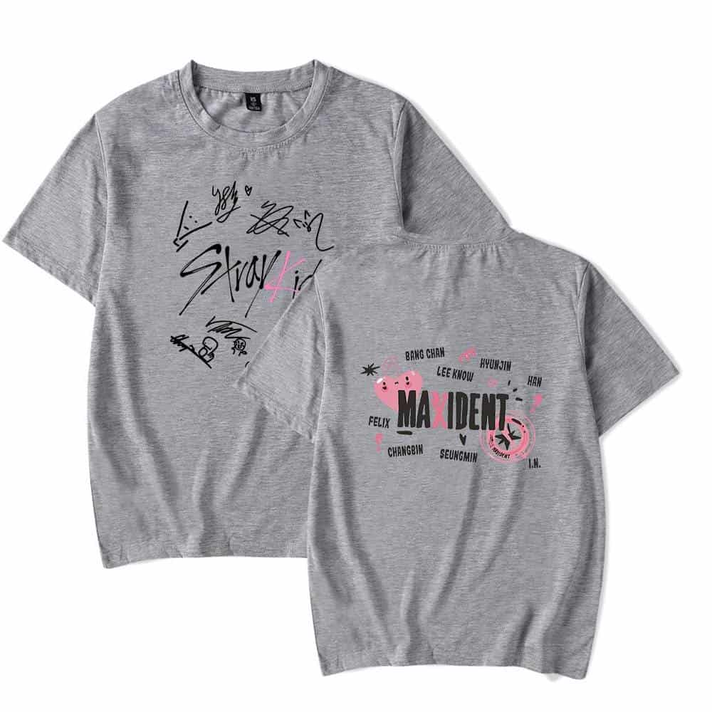 Autographed K-pop merchandise t-shirts featuring MAXIDENT group members with signature graphics and fan art design.