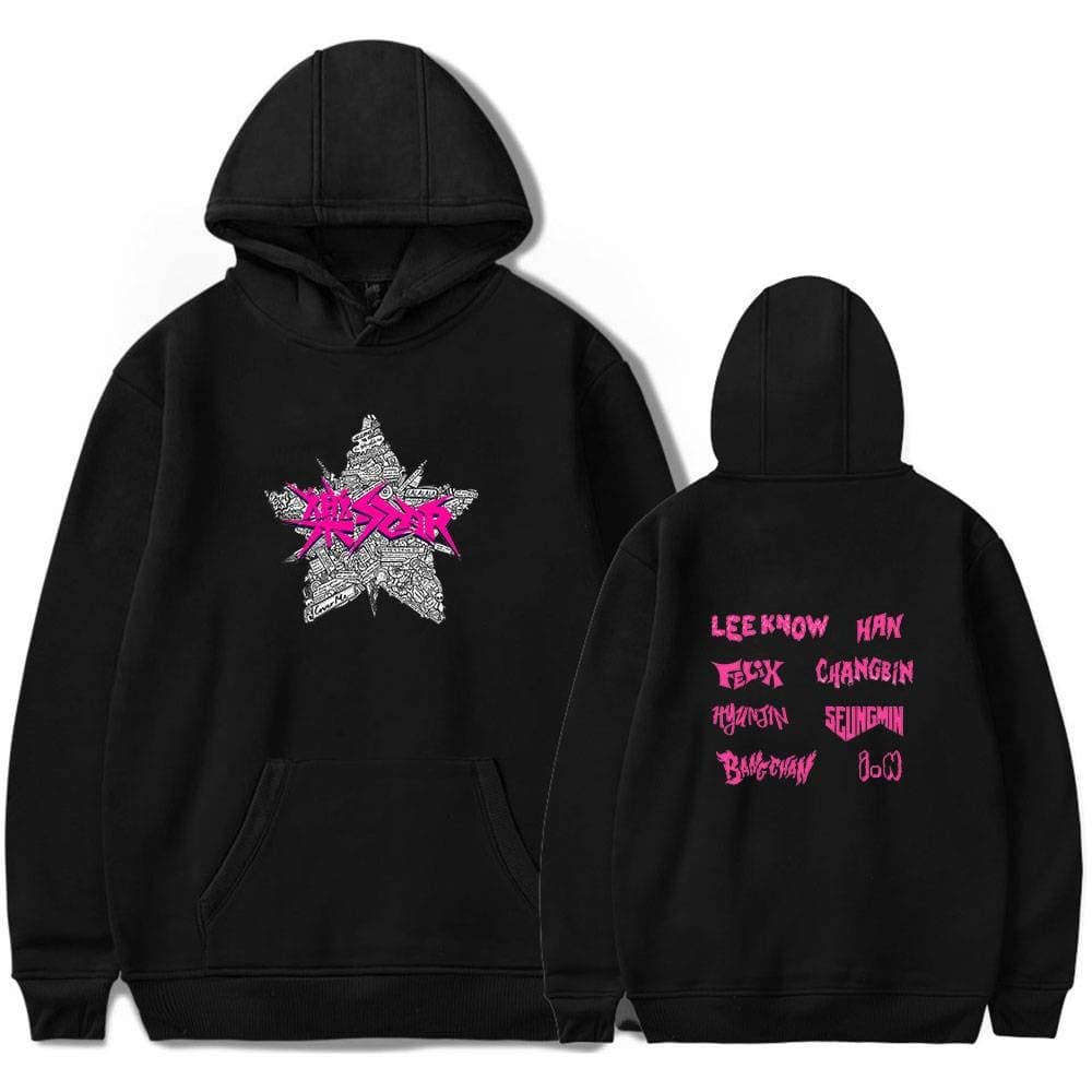 A black hoodie featuring a pink "TS*ST" logo and list of K-pop group member names in pink on the back, representing trendy K-pop merch.
