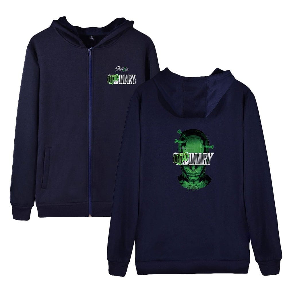 Dark blue hoodie with green and white graphic design and "PRIMARY" text on the front and back, featuring a sci-fi inspired skull illustration.